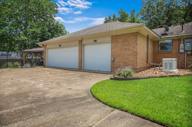 1405 Oak Hill Pl, Lufkin, TX 75904 - view of side of property with brick siding, driveway, a shingled roof, and a garage