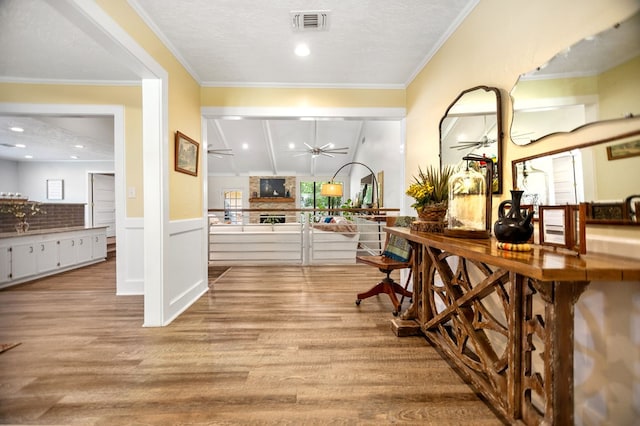 1405 Oak Hill Pl, Lufkin, TX 75904 - bar area with ceiling fan, wood finished floors, and wainscoting