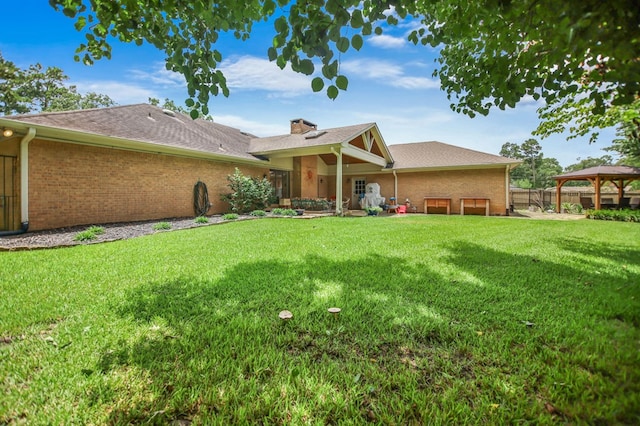 1405 Oak Hill Pl, Lufkin, TX 75904 - rear view of house featuring a gazebo, a chimney, and brick siding