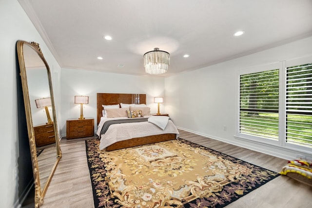 1405 Oak Hill Pl, Lufkin, TX 75904 - bedroom featuring recessed lighting, a chandelier, light wood finished floors, and crown molding