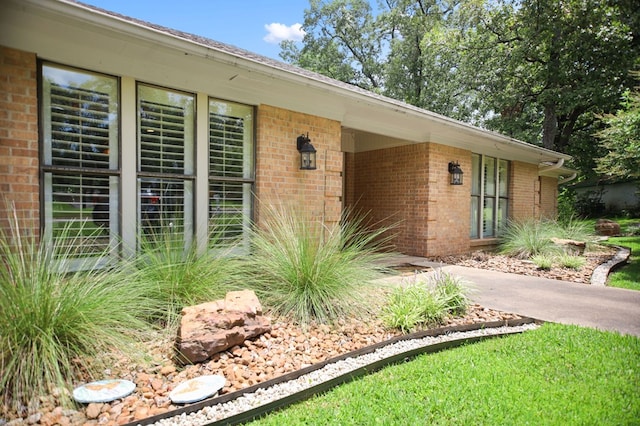 1405 Oak Hill Pl, Lufkin, TX 75904 - view of exterior entry featuring brick siding