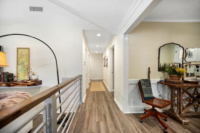 1405 Oak Hill Pl, Lufkin, TX 75904 - hallway with wood finished floors, crown molding, recessed lighting, and an upstairs landing