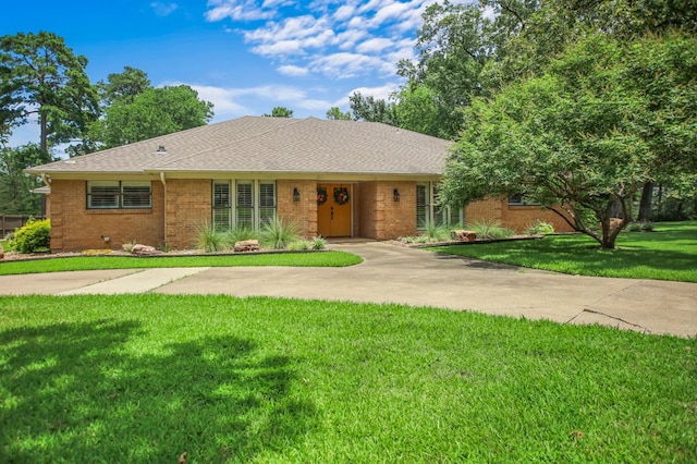1405 Oak Hill Pl, Lufkin, TX 75904 - ranch-style home with brick siding, a front lawn, and roof with shingles
