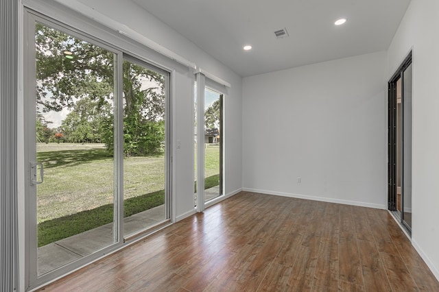 20 Coolcrest Dr, Point Blank, TX 77364 - empty room with hardwood / wood-style flooring and recessed lighting