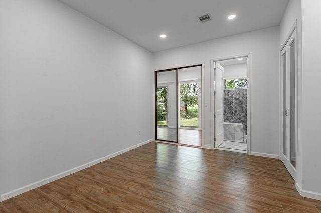 20 Coolcrest Dr, Point Blank, TX 77364 - spare room with wood finished floors and recessed lighting