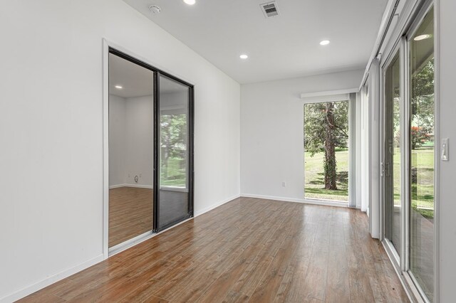 20 Coolcrest Dr, Point Blank, TX 77364 - spare room featuring wood finished floors, recessed lighting, and a smoke detector