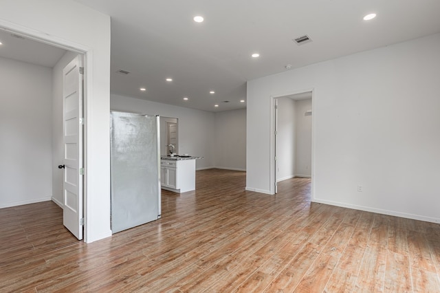20 Coolcrest Dr, Point Blank, TX 77364 - empty room featuring light wood-type flooring and recessed lighting