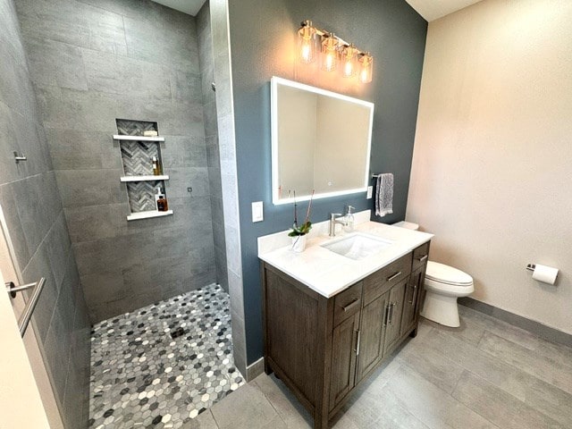 304 Lcr 485, Mexia, TX 76667 - full bathroom with baseboards, toilet, a walk in shower, vanity, and tile patterned floors