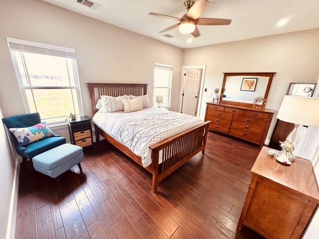 304 Lcr 485, Mexia, TX 76667 - bedroom with dark wood-style flooring, ceiling fan, and visible vents