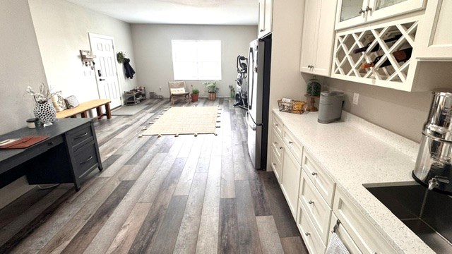 304 Lcr 485, Mexia, TX 76667 - bar with dark wood-type flooring and freestanding refrigerator