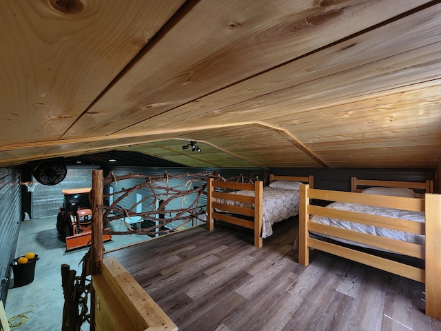 unfurnished bedroom featuring wooden ceiling, wood-type flooring, and vaulted ceiling