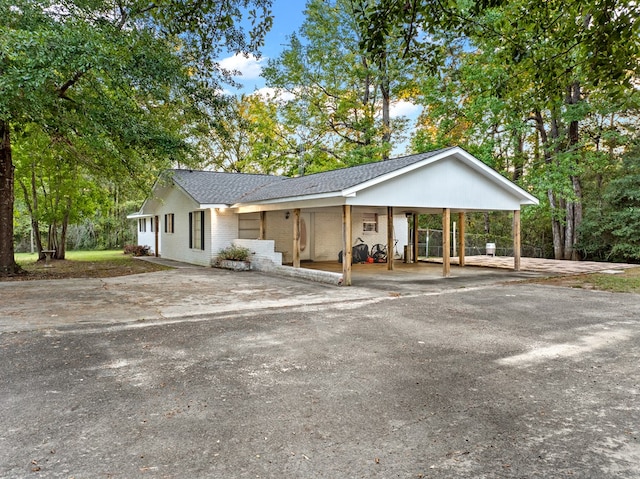 ranch-style home with a carport