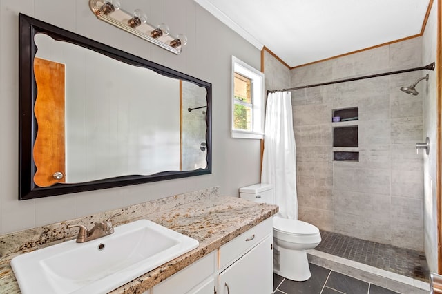 bathroom with vanity, tile patterned floors, a shower with curtain, crown molding, and toilet