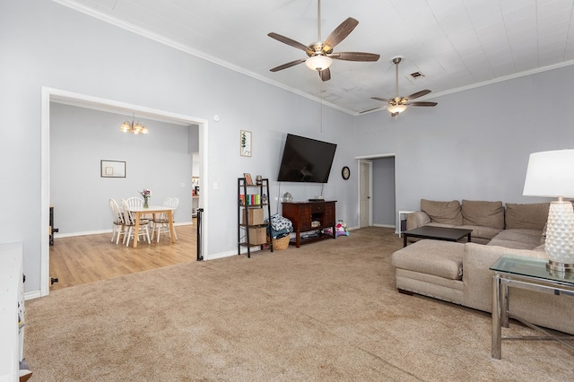 240 W 7th St, Trinity, TX 75862 - carpeted living room featuring crown molding, ceiling fan, baseboards, and a chandelier