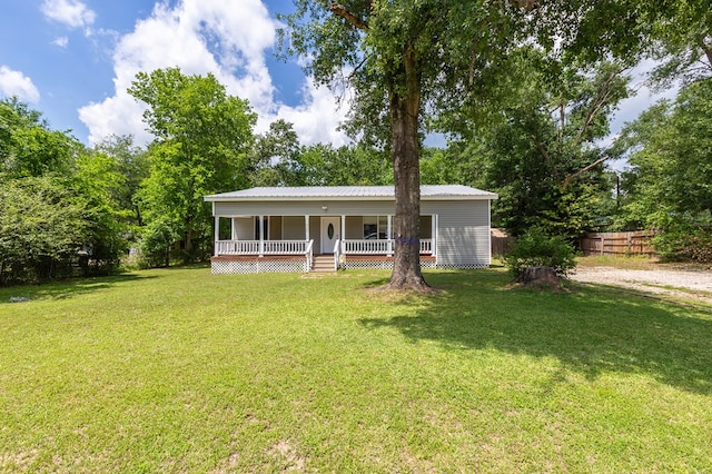 240 W 7th St, Trinity, TX 75862 - view of front of property with a porch and metal roof