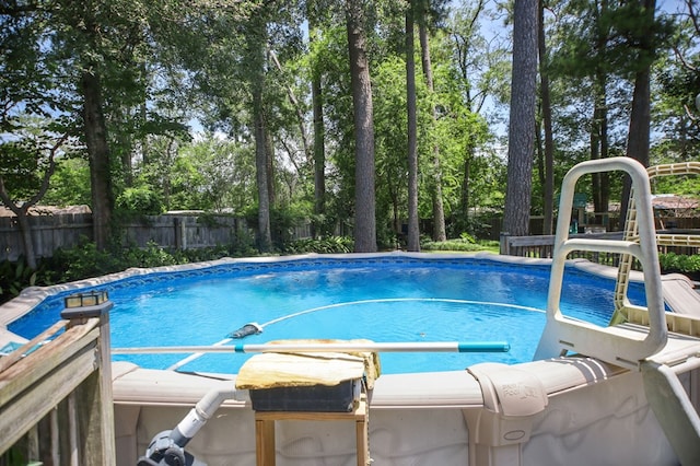 4 Pinemont Pl, Lufkin, TX 75904 - view of swimming pool with a fenced backyard and view of scattered trees