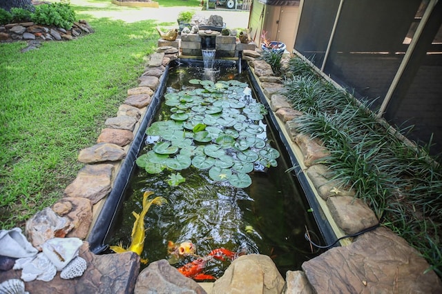 4 Pinemont Pl, Lufkin, TX 75904 - view of grassy yard with a garden pond