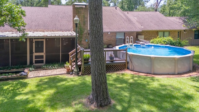 4 Pinemont Pl, Lufkin, TX 75904 - outdoor pool featuring a sunroom, a lawn, and a wooden deck