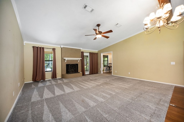 4 Pinemont Pl, Lufkin, TX 75904 - unfurnished living room featuring ornamental molding, a chandelier, a ceiling fan, a fireplace, and vaulted ceiling