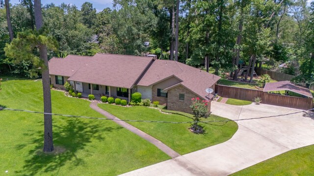 4 Pinemont Pl, Lufkin, TX 75904 - view of front facade with concrete driveway and view of scattered trees