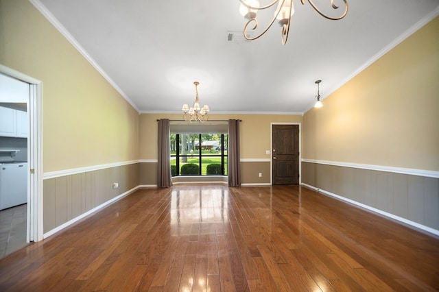 4 Pinemont Pl, Lufkin, TX 75904 - unfurnished living room featuring a chandelier, hardwood / wood-style floors, wainscoting, and crown molding