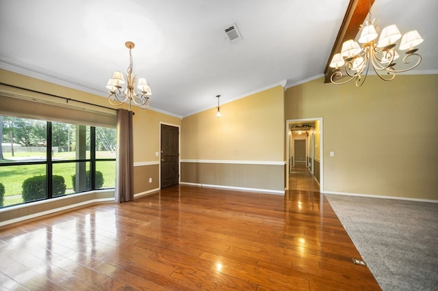 4 Pinemont Pl, Lufkin, TX 75904 - unfurnished room with a chandelier, crown molding, vaulted ceiling, wood finished floors, and a wainscoted wall