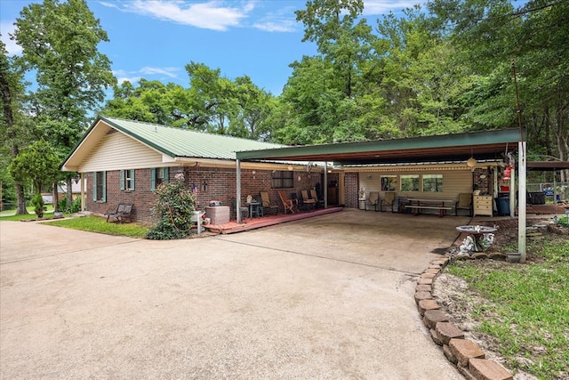 view of side of home featuring a carport