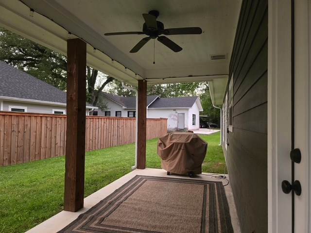 view of patio with a ceiling fan, visible vents, fence, and area for grilling
