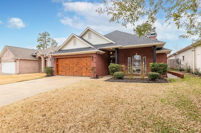 view of front of house with a garage and a front lawn