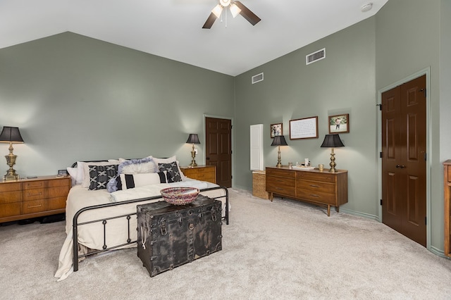 bedroom with high vaulted ceiling, light carpet, and ceiling fan