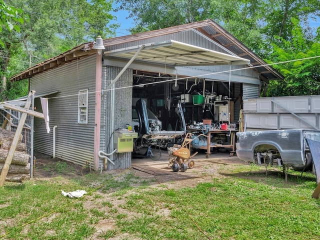 203 Chandler St, Diboll, TX 75941 - view of outbuilding with a carport