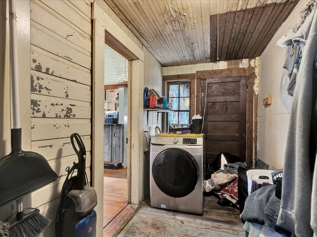 203 Chandler St, Diboll, TX 75941 - laundry room featuring washer / dryer, wooden ceiling, wood finished floors, and wooden walls