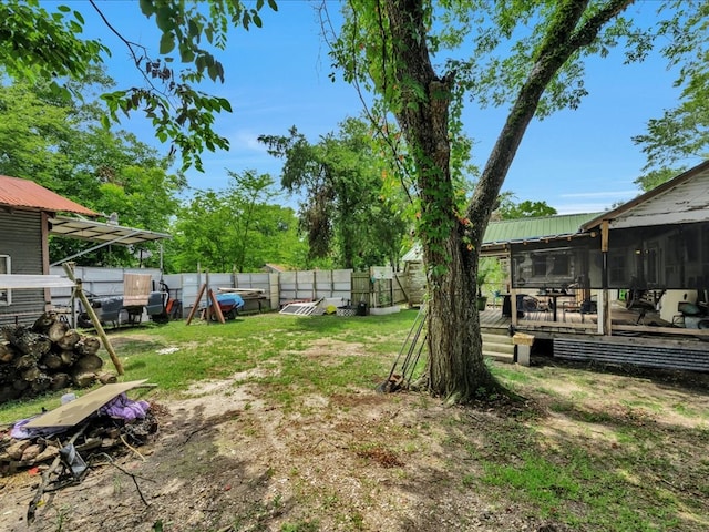 203 Chandler St, Diboll, TX 75941 - fenced backyard with a sunroom and a wooden deck