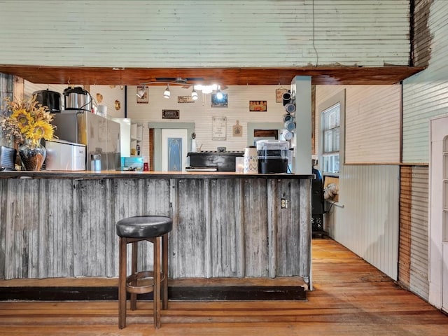 203 Chandler St, Diboll, TX 75941 - kitchen featuring stainless steel fridge and wood finished floors