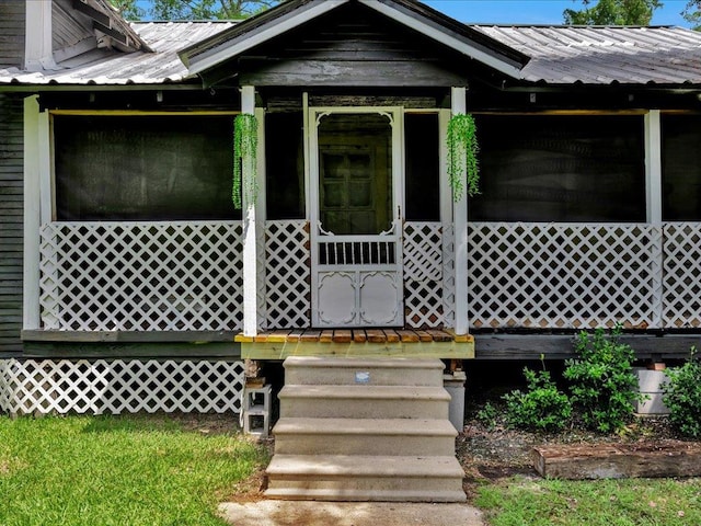 203 Chandler St, Diboll, TX 75941 - property entrance with a metal roof and a porch