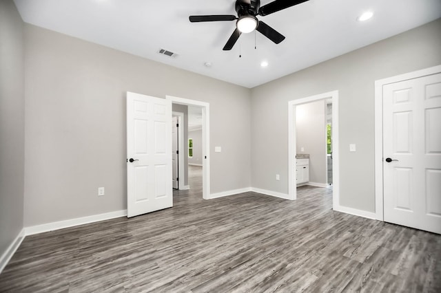 2510 Jimmie, Lufkin, TX 74904 - unfurnished bedroom with wood finished floors, baseboards, recessed lighting, ensuite bathroom, and a ceiling fan