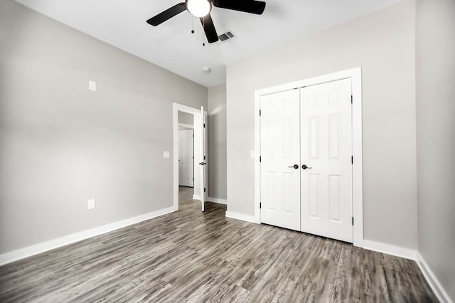 2510 Jimmie, Lufkin, TX 74904 - unfurnished bedroom featuring wood finished floors, baseboards, a closet, and a ceiling fan