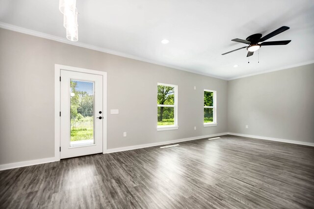 2510 Jimmie, Lufkin, TX 74904 - unfurnished living room featuring plenty of natural light, ornamental molding, baseboards, a ceiling fan, and dark wood-type flooring