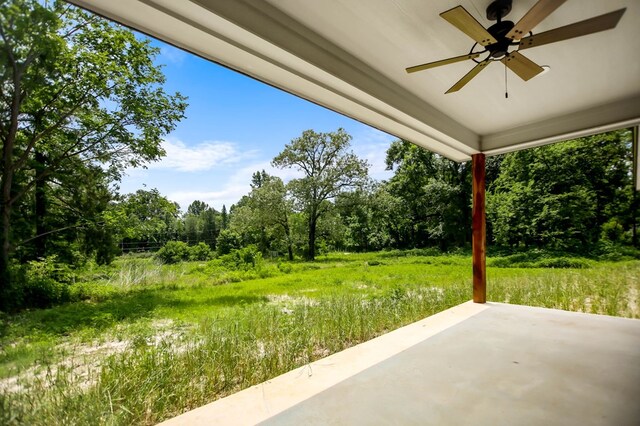 2510 Jimmie, Lufkin, TX 74904 - view of patio / terrace with a ceiling fan and view of wooded area