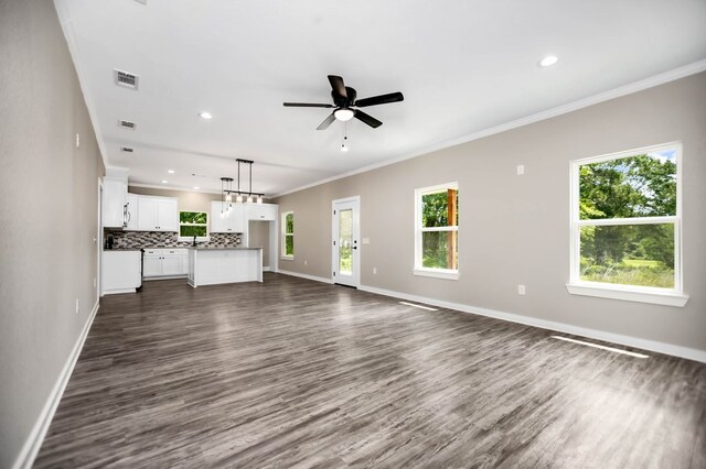 2510 Jimmie, Lufkin, TX 74904 - unfurnished living room with baseboards, dark wood-style flooring, ceiling fan, ornamental molding, and recessed lighting