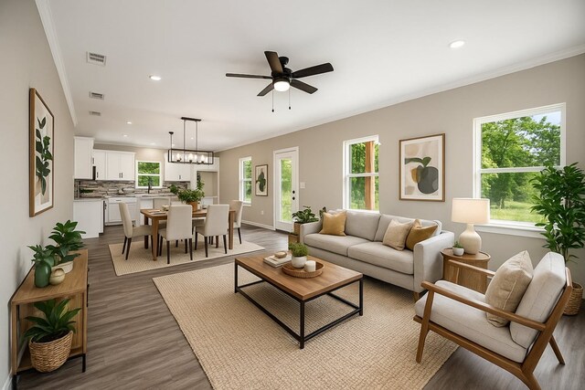 2510 Jimmie, Lufkin, TX 74904 - living area featuring crown molding, wood finished floors, a ceiling fan, recessed lighting, and baseboards