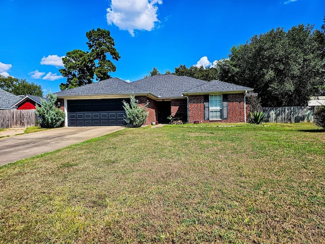 single story home with a garage and a front lawn