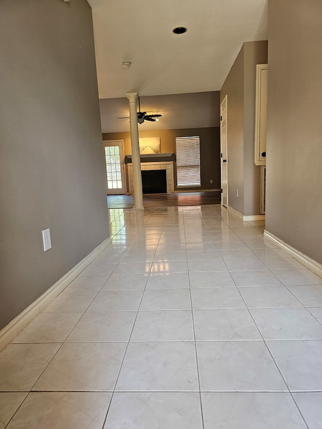 hall featuring light tile patterned floors