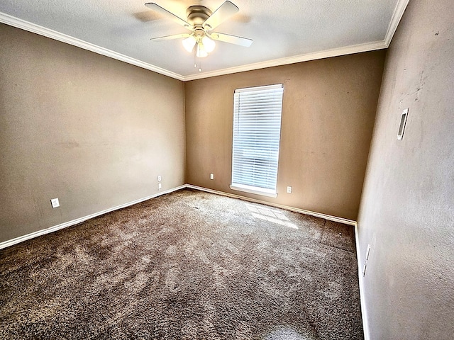 carpeted empty room featuring ceiling fan, a textured ceiling, and ornamental molding