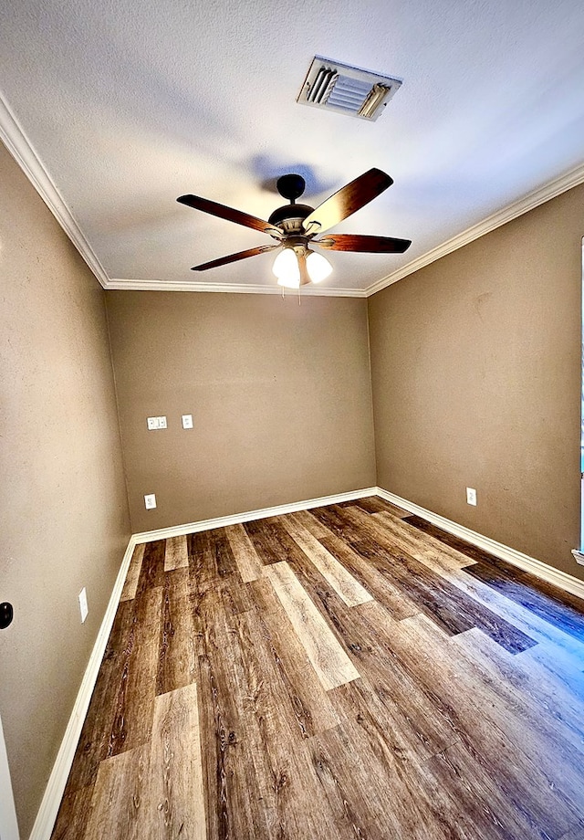 spare room featuring crown molding, hardwood / wood-style floors, ceiling fan, and a textured ceiling