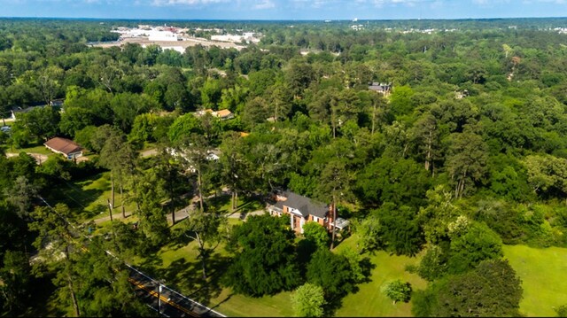 drone / aerial view featuring a forest view