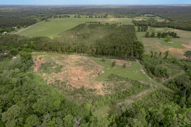 aerial view with a wooded view and a rural view