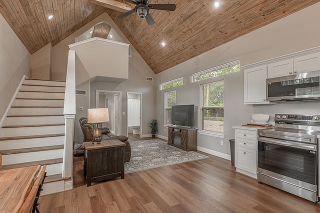 living room with recessed lighting, high vaulted ceiling, and wooden ceiling