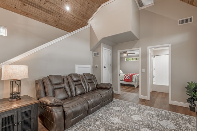 living area featuring wooden ceiling, high vaulted ceiling, and visible vents