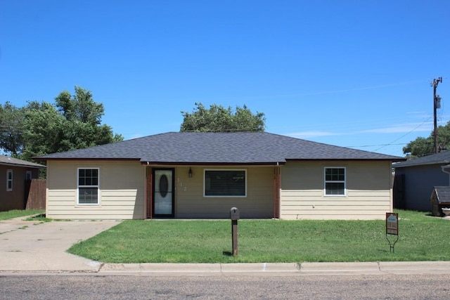 ranch-style house featuring a front lawn